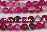 CAG2085 15.5 inches 6mm faceted round fuchsia line agate beads