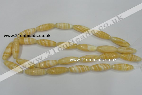 CCA209 15.5 inches 10*30mm rice yellow lace calcite beads