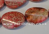 CDE575 15.5 inches 18*25mm twisted oval dyed sea sediment jasper beads