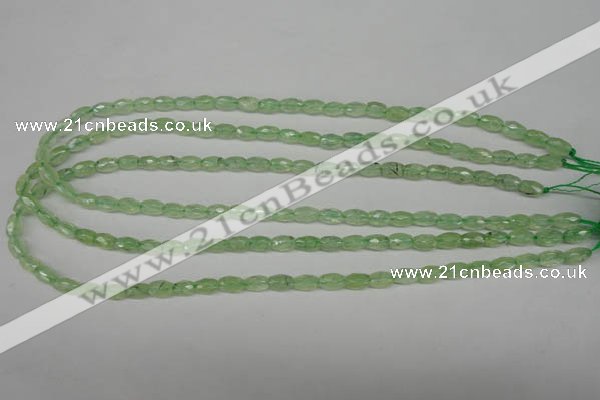 CRU165 15.5 inches 5*8mm faceted rice green rutilated quartz beads