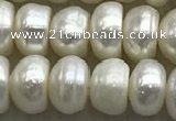 FWP322 15 inches 6mm - 7mm button white freshwater pearl strands