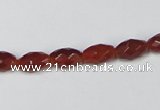 CAA124 15.5 inches 6*10mm faceted rice red agate gemstone beads