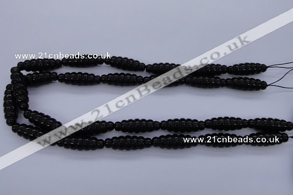 CAG1695 15.5 inches 10*30mm carved rice black agate beads