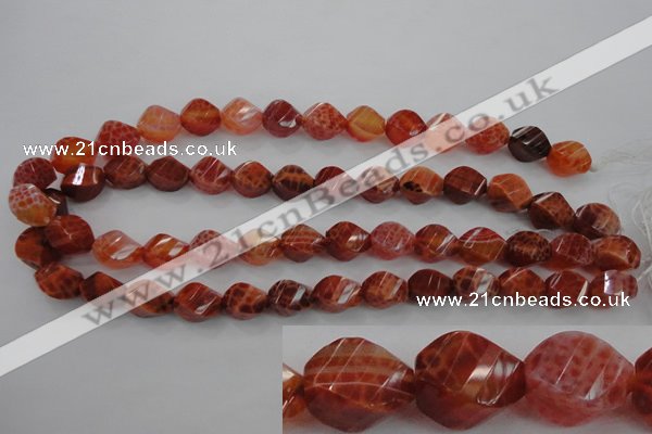 CAG582 15.5 inches 10*14mm faceted & twisted rice natural fire agate beads