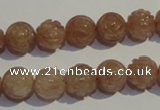 CBQ14 15.5 inches 10mm carved round strawberry quartz beads