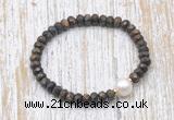 CFB754 faceted rondelle bronzite & potato white freshwater pearl stretchy bracelet