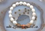 CFB913 9mm - 10mm rice white freshwater pearl & rainbow moonstone stretchy bracelet