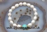 CFB926 9mm - 10mm rice white freshwater pearl & blue sea sediment jasper stretchy bracelet
