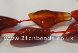 CFG563 15.5 inches 14*28mm carved trumpet flower red agate beads