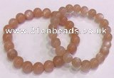 CGB4587 7.5 inches 8mm - 9mm round sunstone beaded bracelets