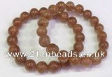 CGB4609 10mm - 11mm round golden rutilated quartz beaded bracelets