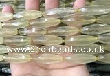 CRI132 15.5 inches 10*30mm faceted rice lemon quartz beads