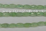 CRU165 15.5 inches 5*8mm faceted rice green rutilated quartz beads