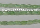 CRU165 15.5 inches 5*8mm faceted rice green rutilated quartz beads