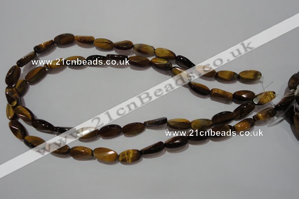 CTE1097 15.5 inches 8*15mm twisted & faceted oval yellow tiger eye beads