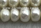 FWP323 15 inches 7mm - 8mm button white freshwater pearl strands